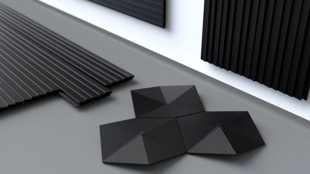 10-materiais-que-podem-mudar-a-construção-divulgação-dezeen-biochar-detalhe foto mostra material de construção que parece uma chapa metálica mas em formato hexagonal.