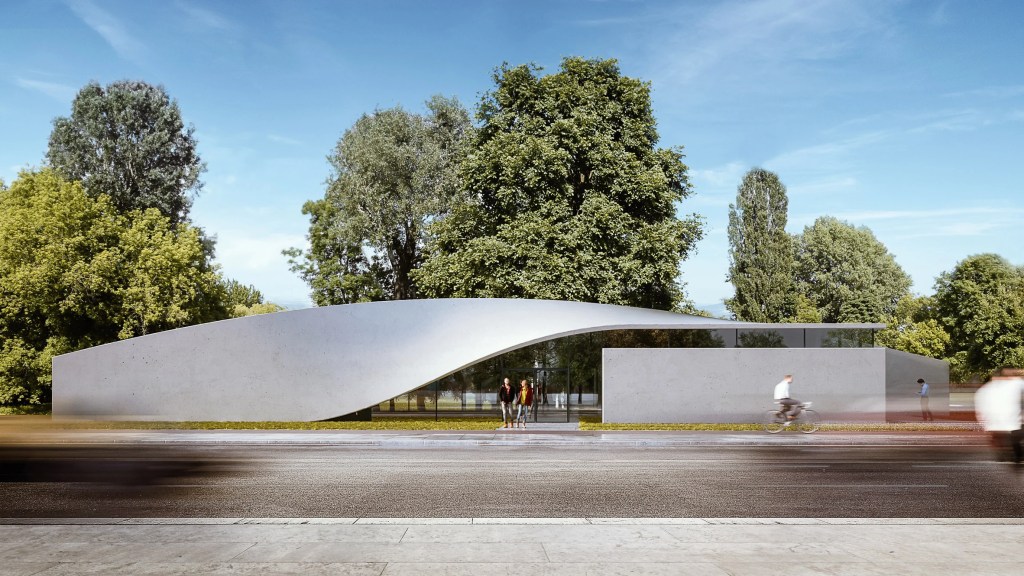 10-materiais-que-podem-mudar-a-construção-divulgação-dezeen-concreto-de-carbono Foto mostra cobertura de construção em tom acinzentado, com árvore alta ao fundo.
