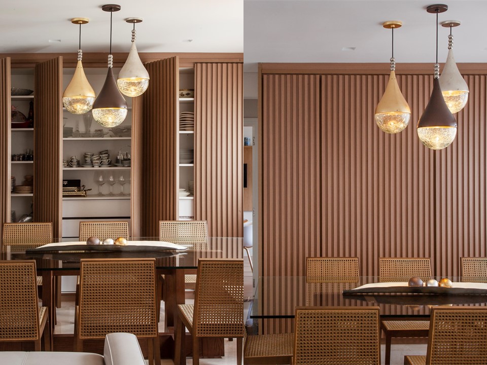 Sala de jantar com armário mimetizado em painéis ripados